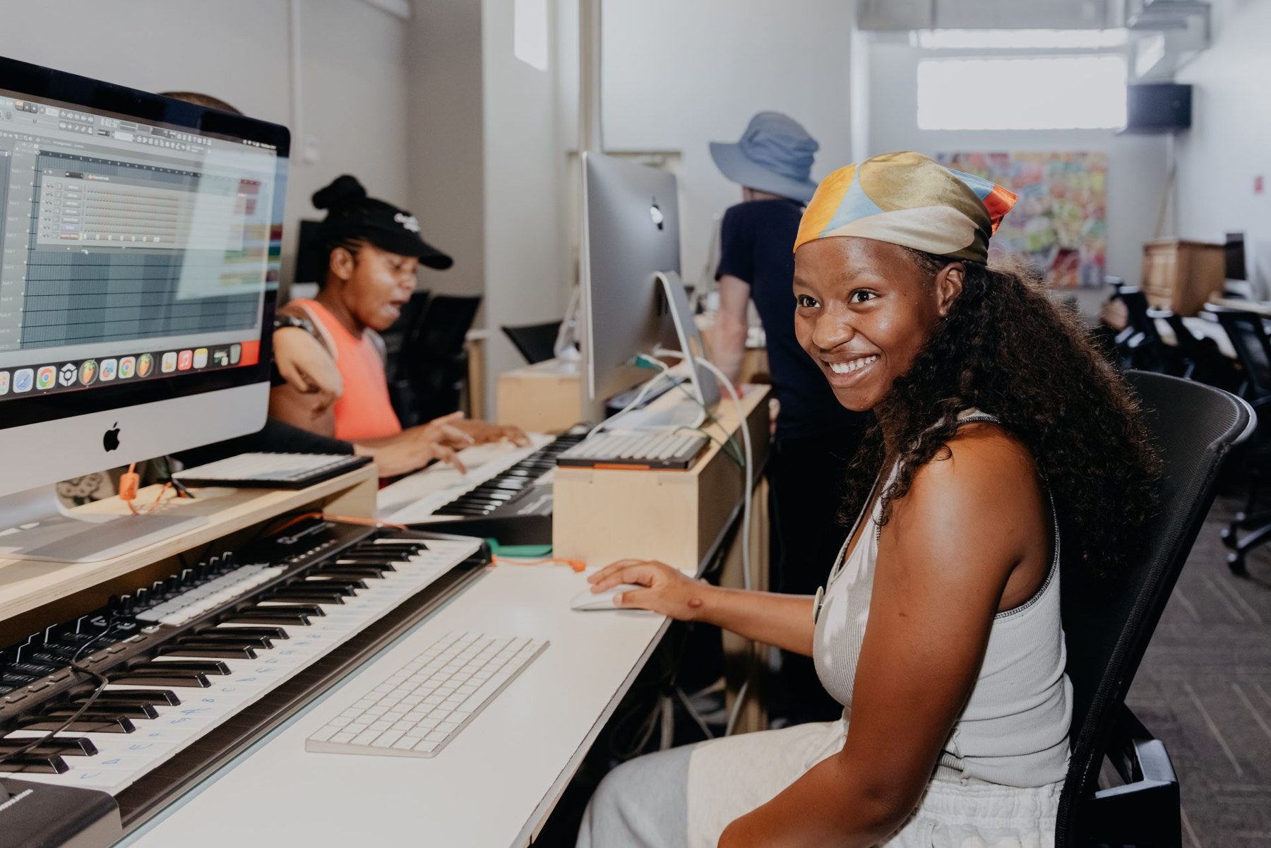 A participant at a keyboard in the Bridges for Music studio